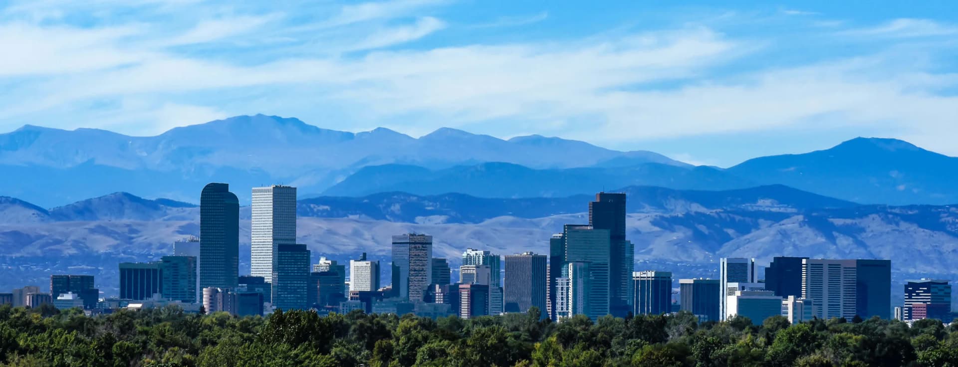 Denver skyline and the Colorado Front Range under clear blue skies
